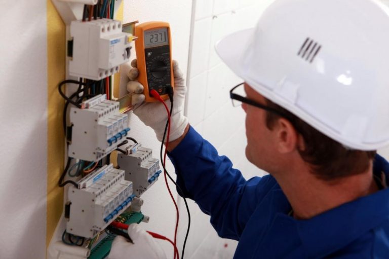 An electrician inspecting a home electrical system.
