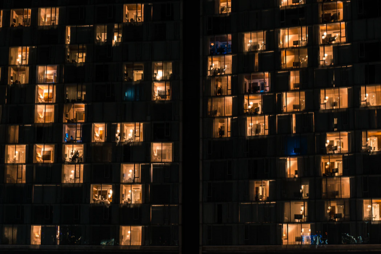 Apartments lit up in a residential building.